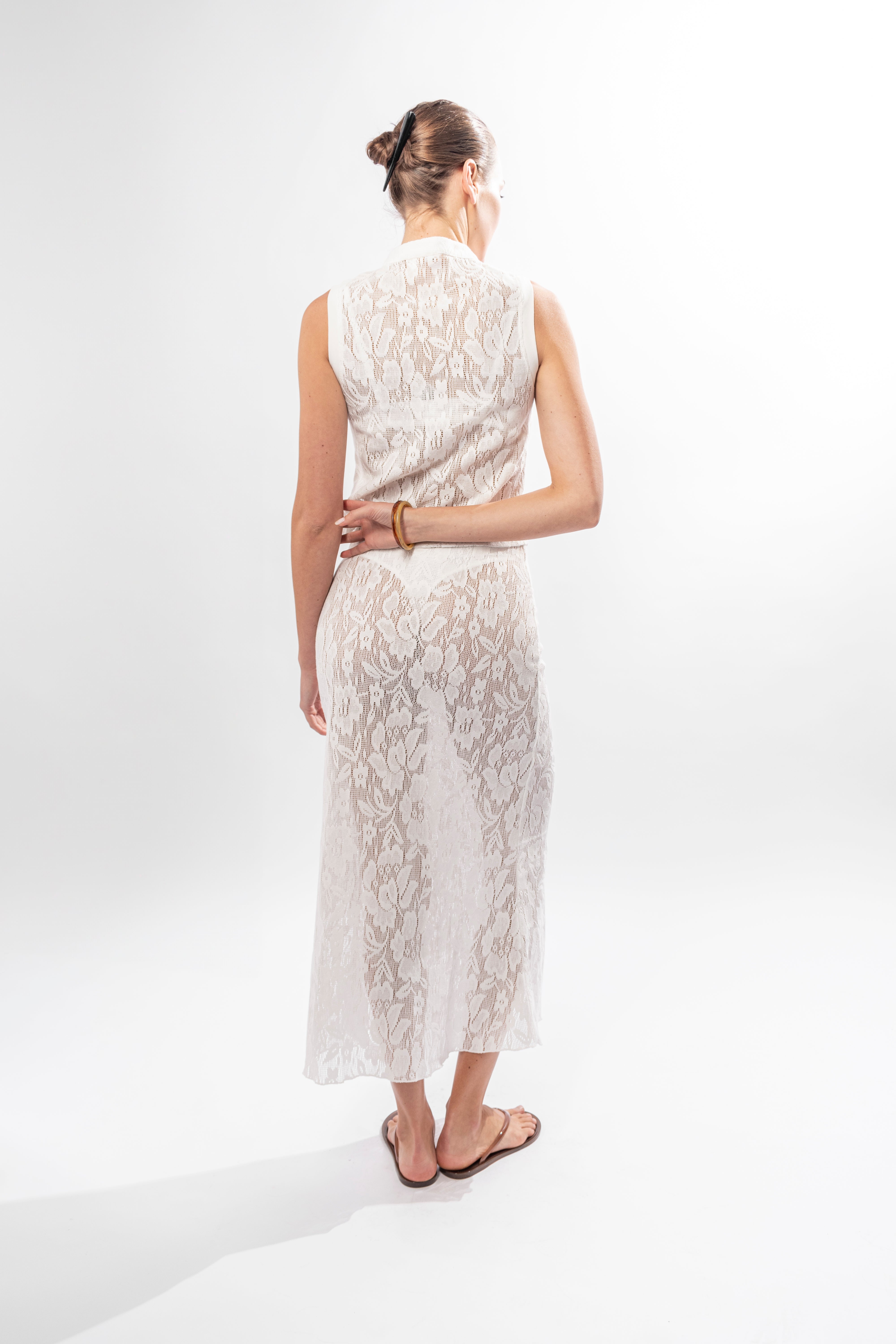 Back view of lace midi skirt with tailored waist fit